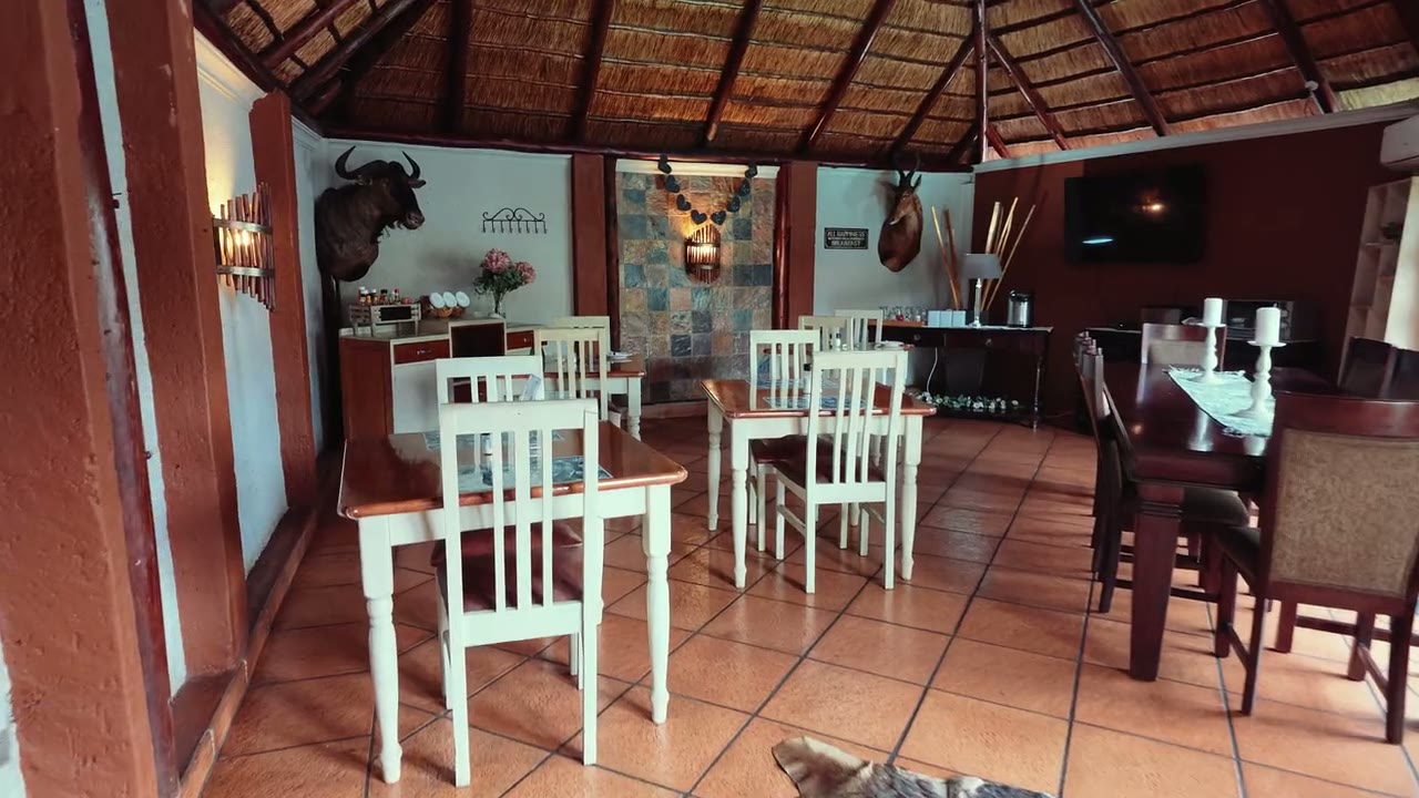 Thatched lapa dining area at Big 5 Guesthouse, Kempton Park
