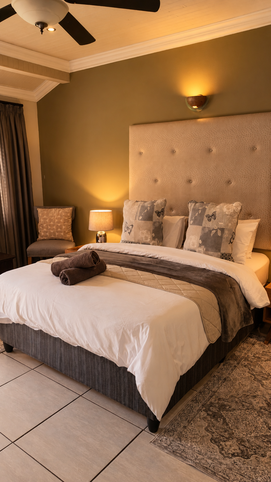 Warm bedroom with tufted headboard in Room 8 at Big 5 Guesthouse, Kempton Park